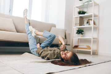 Relaxing in a Cosy Modern Apartment: Sofa, Woman Lying on Floor, Happy and Chill