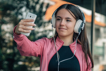 student girl at the institute with headphones