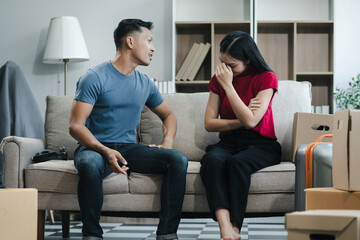 Unhappy young couple, having problems in relationship, thinking of breaking up or divorce, upset.