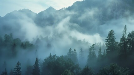 Majestic fog-shrouded mountains in mystical morning scene