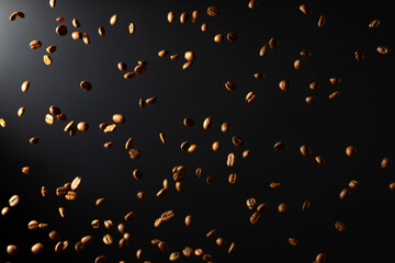 Coffee beans in motion on a black background.