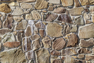 Stone wall texture. Brown background of stones
