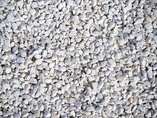 Texture of white decorative stones. White gravel