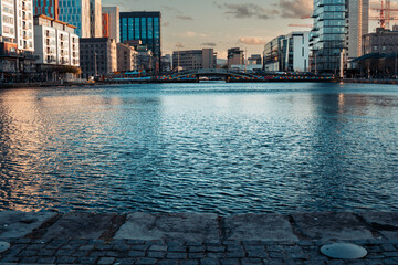 Fototapeta premium View Of Grand Canal Dock From Grand Canal Square In Dublin Docklands. Symbol of urban regeneration and technological advancement. With modern architecture and corporate headquarters, including those