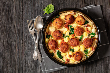 tuscan chicken meatballs with gnocchi in a dish