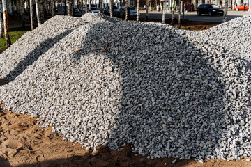 A layer of gravel covers a layer of dirt, ready for landscaping or events