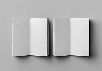 An open rectangle book with white paper pages rests on a gray table