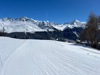 Amazing sport-recreational snowy winter tracks for skiing and snowboarding in the area of the tourist resorts of Valbella and Lenzerheide in the Swiss Alps - Canton of Grisons, Switzerland (Schweiz)