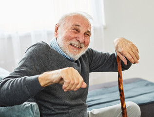 senior disabled man walking cane stick portrait health retirement elderly happy cheerful alone...