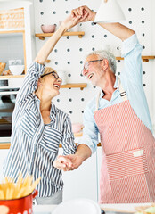 love kitchen senior woman man couple home retirement happy food smiling husband wife together...
