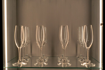 close-up of the style in the house with champagne glasses standing in four rows