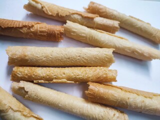 Kue semprong or Asian egg roll. This is a traditional Indonesian wafer or kuih snack isolated on a white background