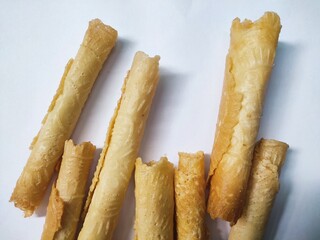 Kue semprong or Asian egg roll. This is a traditional Indonesian wafer or kuih snack isolated on a white background