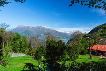 The Alps and Lake Como during a spring morning, near the village of Varenna, Italy - April 14, 2024
