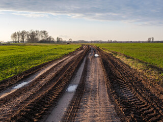 Latvian Passage: Journey Through Fields and Mud