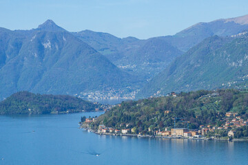 Fototapeta na wymiar The Alps and Lake Como during a spring morning, near the village of Varenna, Italy - April 14, 2024