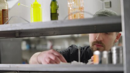 a professional chef inspects all completed orders and makes an inventory of orders in the kitchen in a restaurant. Checking orders in the kitchen to structure the work of cooks