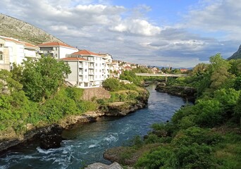 Fototapeta na wymiar Neretva River and bridge in Mostar, Bosnia and Herzegovina at daytime in spring