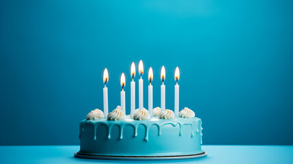 A birthday cake in a plate with candles on it over lite pink background