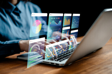 Businesswomen analyze chart data business on a visual screen dashboard laptop, technology devices...