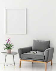Empty, white frame on the wall in a room above a gray armchair and coffee table
