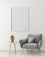Empty, white frame on the wall in a room above a gray armchair and coffee table
