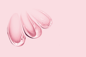 composition of smears of cosmetic pink gel on a pink background