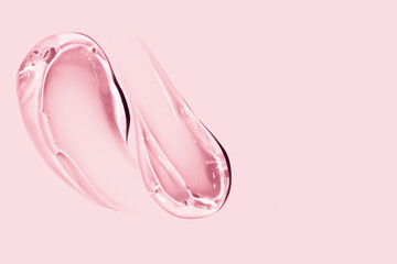 composition of smears of cosmetic pink gel on a pink background
