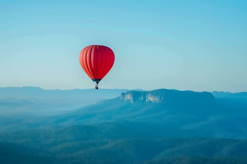 Hot air balloon flying over the mountains. Beautiful landscape with colorful hot air balloons.