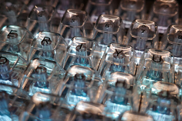 keyboard close-up. clear keys with illuminated characters background technology abstract blue light