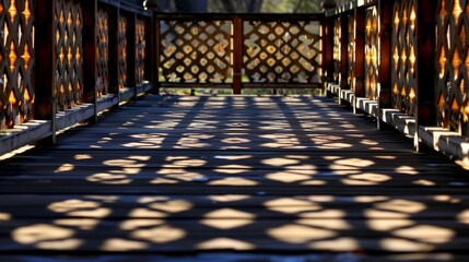 Geometric Patterns: A photograph capturing the shadows of a geometrically patterned fence on the ground