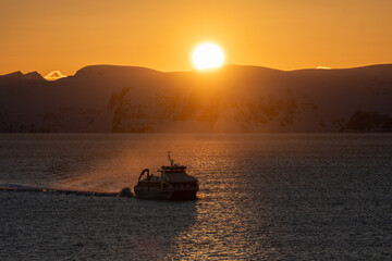 A boat passing by in the sunset light