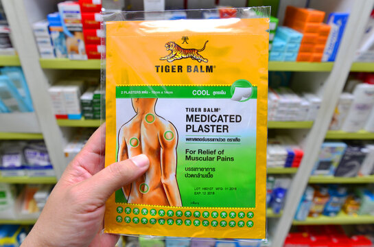 BANGKOK, THAILAND -August 11,2022 : Packages of Tiger Balm in drugstore Bangkok, Thailand Tiger Balm is medicinal ointment made from herbs that has pain-relieving remedy