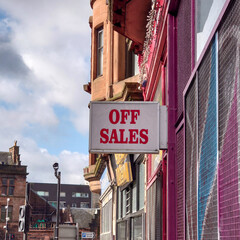 An Off Sales sign bolted to a wall