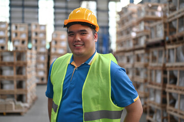Portrait of Asian male worker in warehouse, International export business concept