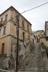 Fototapeta na wymiar Old staircase with historical buildings Vathy. Samos, North Aegean, Greece