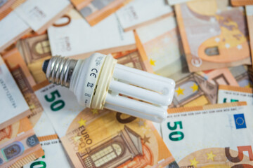 Light bulb with 50 euro note bills , Increase in electricity tariffs