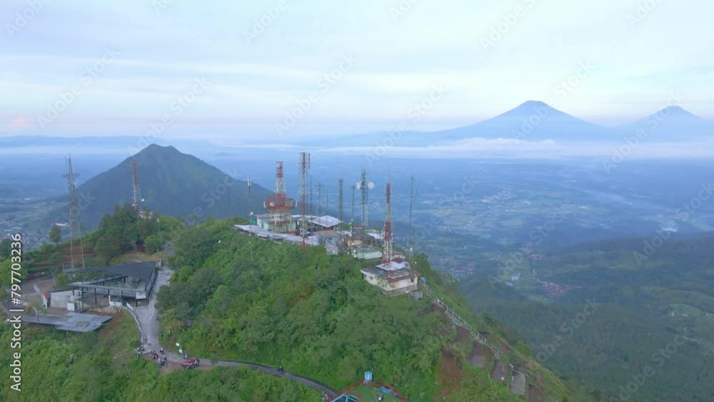 Poster aerial view top of telomoyo mountain with view of mountains surround it. cellular tower building on 