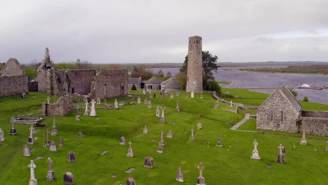 Smooth aerial pan of Clonmacnoise,,cathedral, round towers and high crosses.