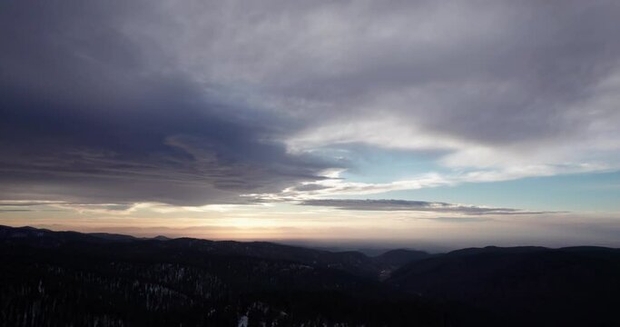 aerial view of a beautiful sunset while flying over the New Mexico forest in the mountains near Cloudcroft