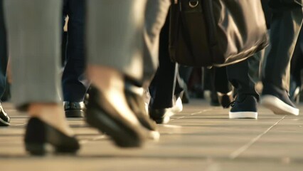 Slow motion crowd of people walking on street. Commuters going to work in the morning.