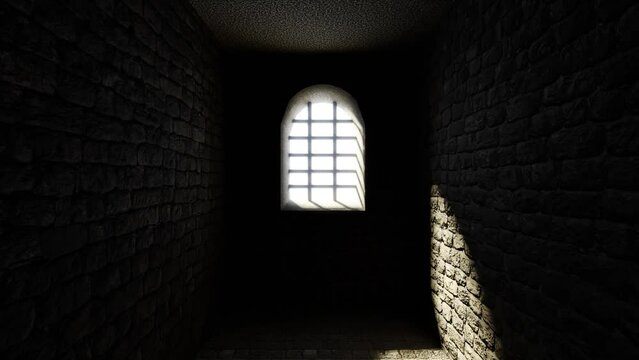 Light in the window of a dungeon in a stone old castle.