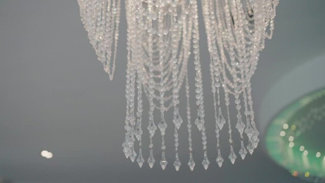 Elegant crystal chandelier with intricate design in a stylish salon