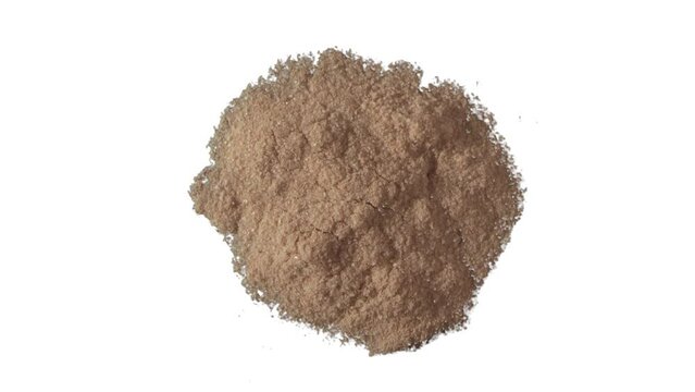 Pile of salt granules, isolated and turning on plain bright white background. Seasoning ingredient. Healthcare, hypertension, restaurant, or recipe concept.