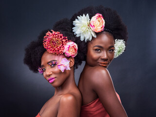 African, beauty and friends with flowers in makeup and art in dark background, studio and mockup....