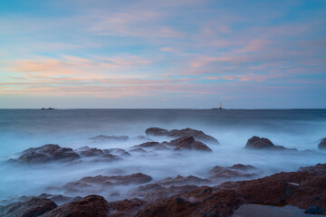 view of the Mangiabarche Lighthouse at sunrise on Sardinia