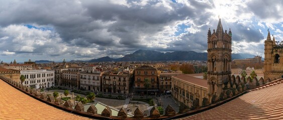 view over the rooftops of downtown Palermo with the cathedral bell tower in the foreground