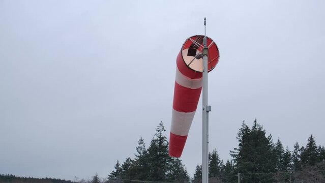 Airport Red and White Windsock Blowing Gently in the Wind STATIC