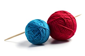 Yarn ball and knitting needle near a piece of knitting.