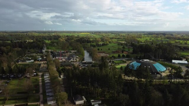 Aerial 4K Drone footage of of Les Ormes Campsite showing the Dome Swimming Pool and Surrounding Pitches. Brittany, France.